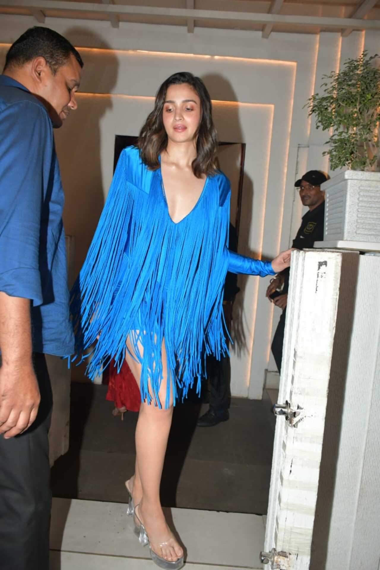 Alia's outfit had tassels cascading from the neckline to the hemline and beyond. She paired it with transparent heels
